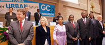 Delegates stand to congratulate students of the Youth Empowerment Programme. L-R: Achim Steiner, Executive Director, UNEP; Inga Bjork-Klevby , Deputy Executive Director, UN-HABITAT; Anna Tibaijuka, Executive Director, UN-HABITAT; Stephen Kalonzo Musyoka, Vice President, Kenya; Soita Shitanda, Minister for Housing, Kenya; Michael Werikhe, Minister of Lands, Housing, and Urban Development, Uganda; and Rolf Wichmann, Secretary, UN-HABITAT Governing Council.